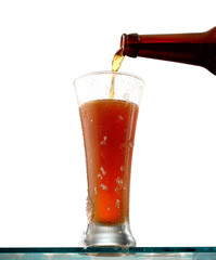 Glass of cold beer on a white background