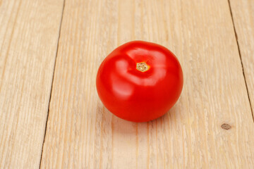 Tomatoes on a white wooden background