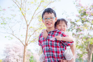 Young asian siblings happy in park