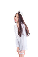 Naklejka premium Young asian boy with long hair over white background