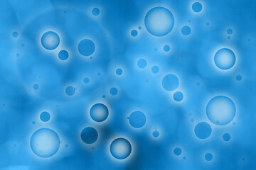 Abstract blurred circle pattern on the blue colored background.