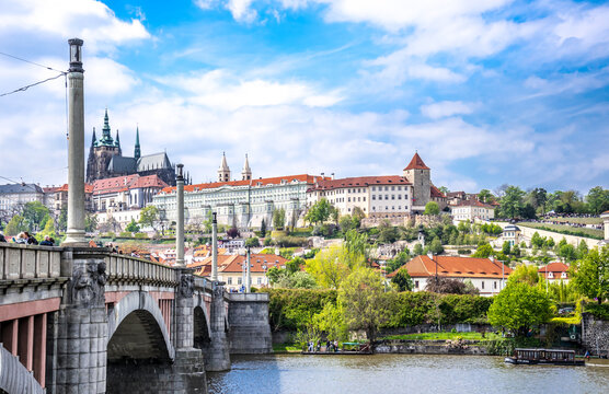 Panorama of the city of Prague. The ancient bridge over the Vltava River and the historic historic center of the city