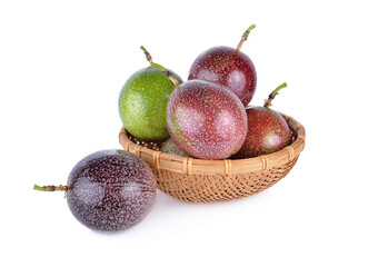 whole passion fruit in basket and on white background