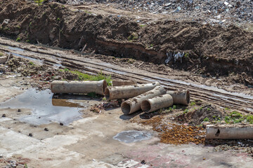 Hastily scattered pipes of the sewage collector