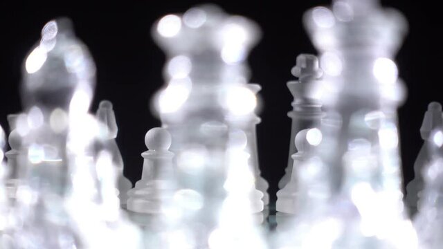 Chess pieces, ready to play. Blue light, dolly  cam
