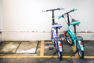 Two bicycles parked at the parking.