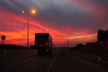 Truck on sunset background
