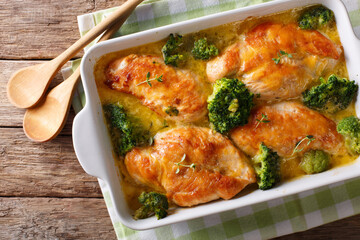 Healthy food: chicken breast baked with broccoli in cheese sauce close-up on the table. horizontal top view
