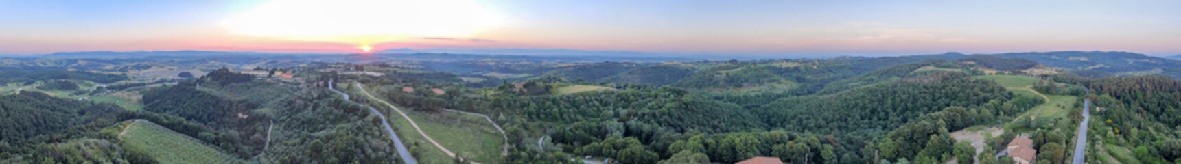 Amazing sunset panoramic aerial view of Tuscany hills in spring season - Italy