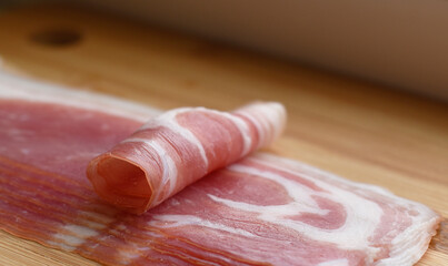 fresh bacon on a cutting Board
