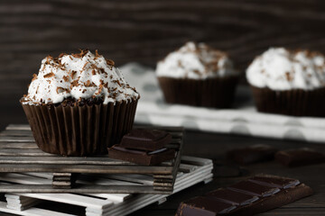 Chocolate-coffee cupcakes on a dark wooden background