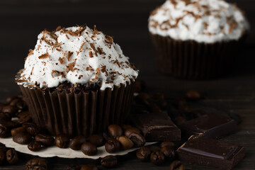 Chocolate-coffee cupcakes on a dark wooden background