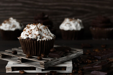 Chocolate-coffee cupcakes on a dark wooden background