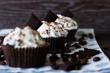 Chocolate-coffee cupcakes on a dark wooden background
