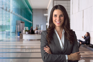 Smiling bank manager welcoming warm personality bright big smile in large building