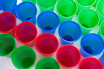 Multicolor plastic glasses isolated on white background