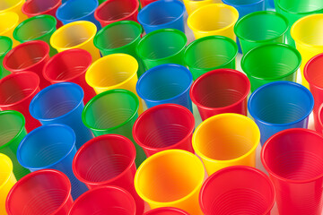 Multicolor plastic glasses isolated on white background