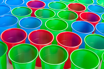 Multicolor plastic glasses isolated on white background