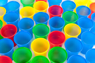 Multicolor plastic glasses isolated on white background