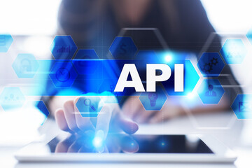 Woman using tablet pc, pressing on virtual screen and selecting api.