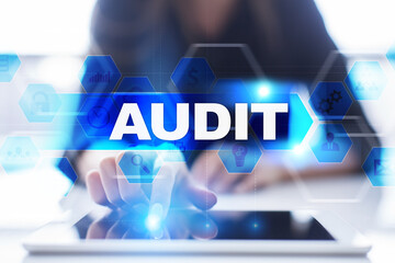 Woman using tablet pc, pressing on virtual screen and selecting audit.