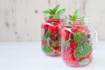 Summer refreshing water with strawberries and mint