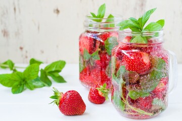 Summer refreshing water with strawberries and mint