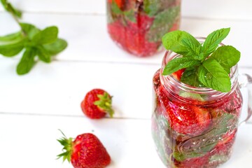 Summer refreshing water with strawberries and mint