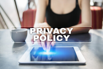 Woman using tablet pc and selecting privacy policy.