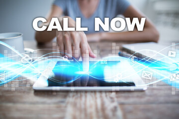 Woman using tablet pc, pressing on virtual screen and selecting call now.