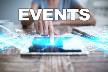 Woman using tablet pc, pressing on virtual screen and selecting events .
