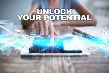 Woman using tablet pc, pressing on virtual screen and selecting unlock your potential.