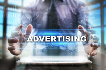 Fototapeta na wymiar Businessman using tablet pc and selecting advertising.