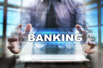Fototapeta na wymiar Businessman using tablet pc and selecting banking.