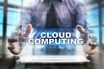 Fototapeta na wymiar Businessman using tablet pc and selecting cloud computing.
