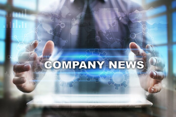 Fototapeta na wymiar Businessman using tablet pc and selecting company news.