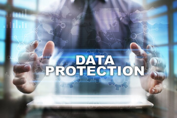 Fototapeta na wymiar Businessman using tablet pc and selecting data protection.