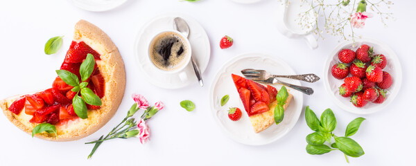 Flat lay with coffee, delicious homemade strawberry cheesecake and flowers over white. Top view.