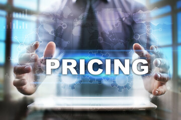 Fototapeta na wymiar Businessman using tablet pc and selecting pricing.