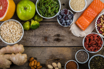 Selection of superfoods on rustic background