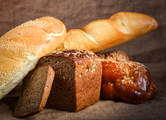 still life of bread and millet in old style on a linen cloth with a distinct texture. The figure also oil and grain cereals and eggs.