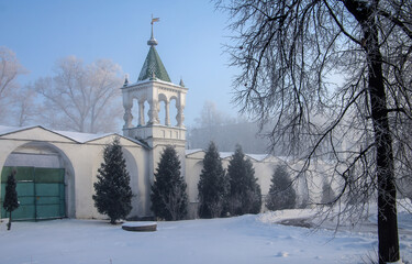 Fototapeta na wymiar Dzerzhinsky, Russia - December, 2016: Ugresha Monastery in a foggy winter day