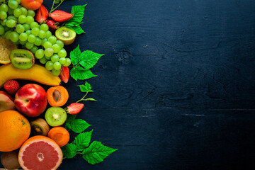 Set of fresh fruits. Healthy food. On Wooden background. Top view. Free space.