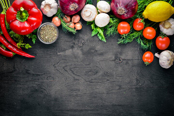 Big set organic food. Fresh raw vegetables. On a black chalkboard.