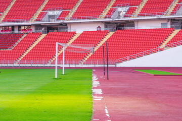 Fototapeta premium Soccer goal football on the green field inside the stadium