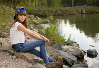 Portrait of cute teen girl in outdoor near lake