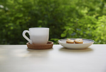 Tea cup with cookies.