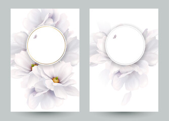 Set of two invitation or congratulation cards with elegant flower composition. Blooming white magnolias formed composition on the white backgrounds.