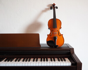Violin leaning on a digital piano