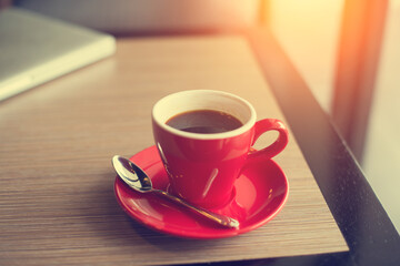 laptop and black coffe in vintage tone